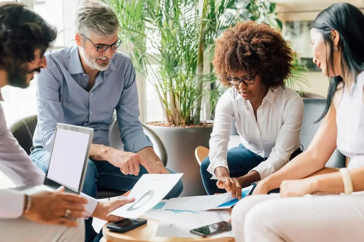 Several people sitting around, planning an HOA budget. 