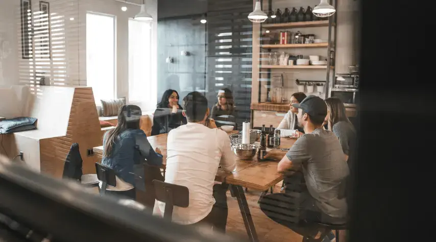 HOA board members discussing ordinances at a coffee shop