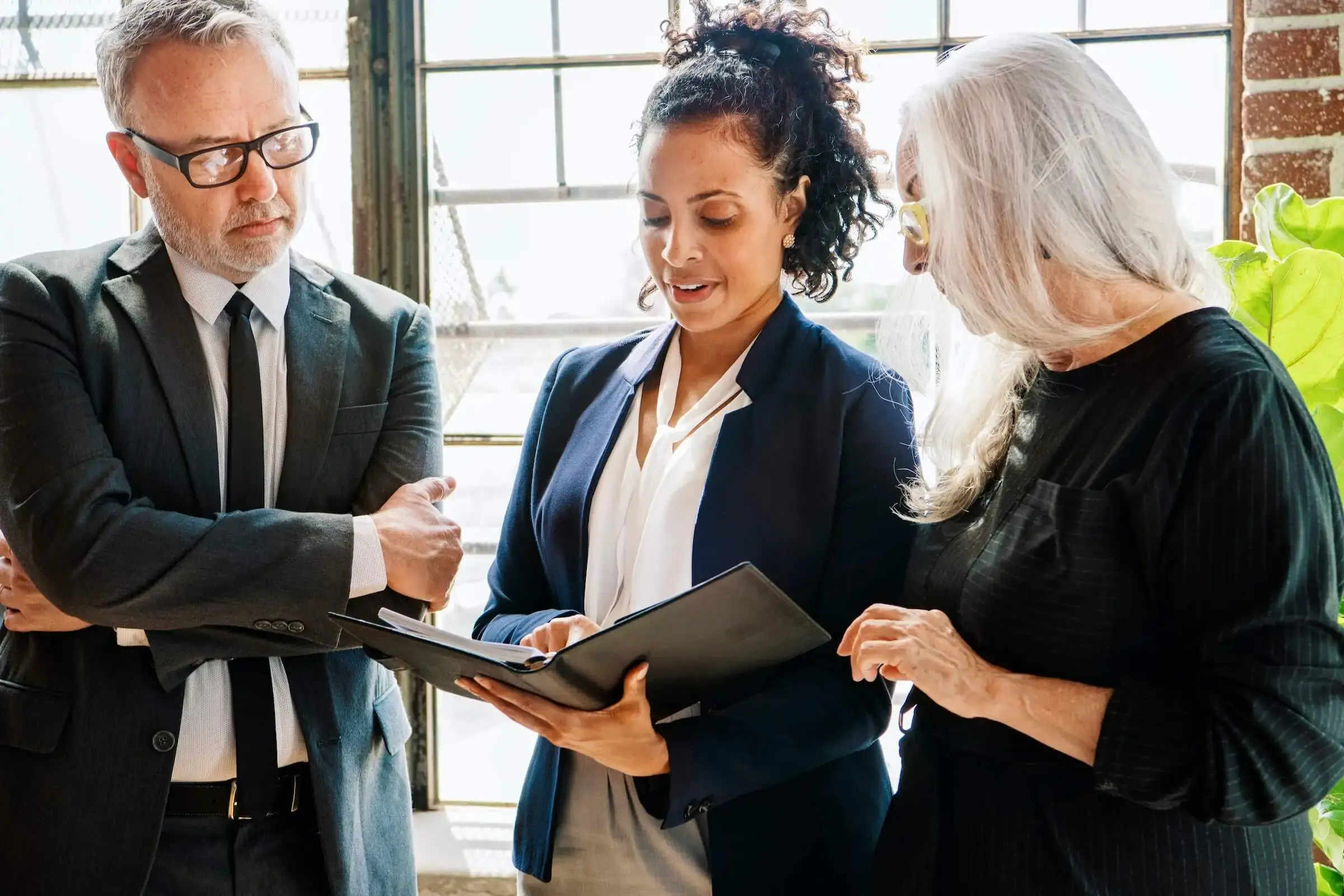 HOA board members review documentation with HOA consultant