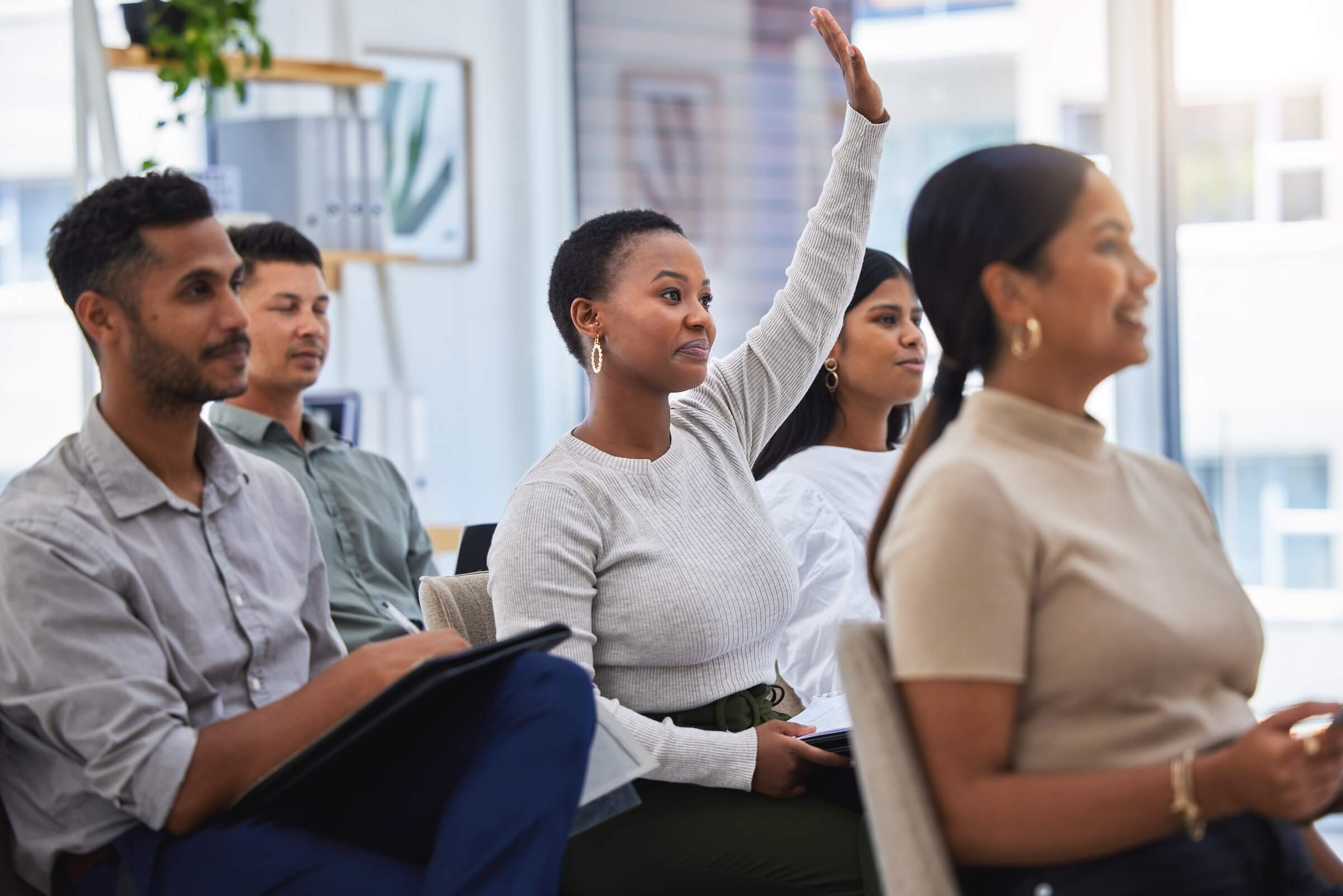 HOA board member raises hand during HOA board meeting
